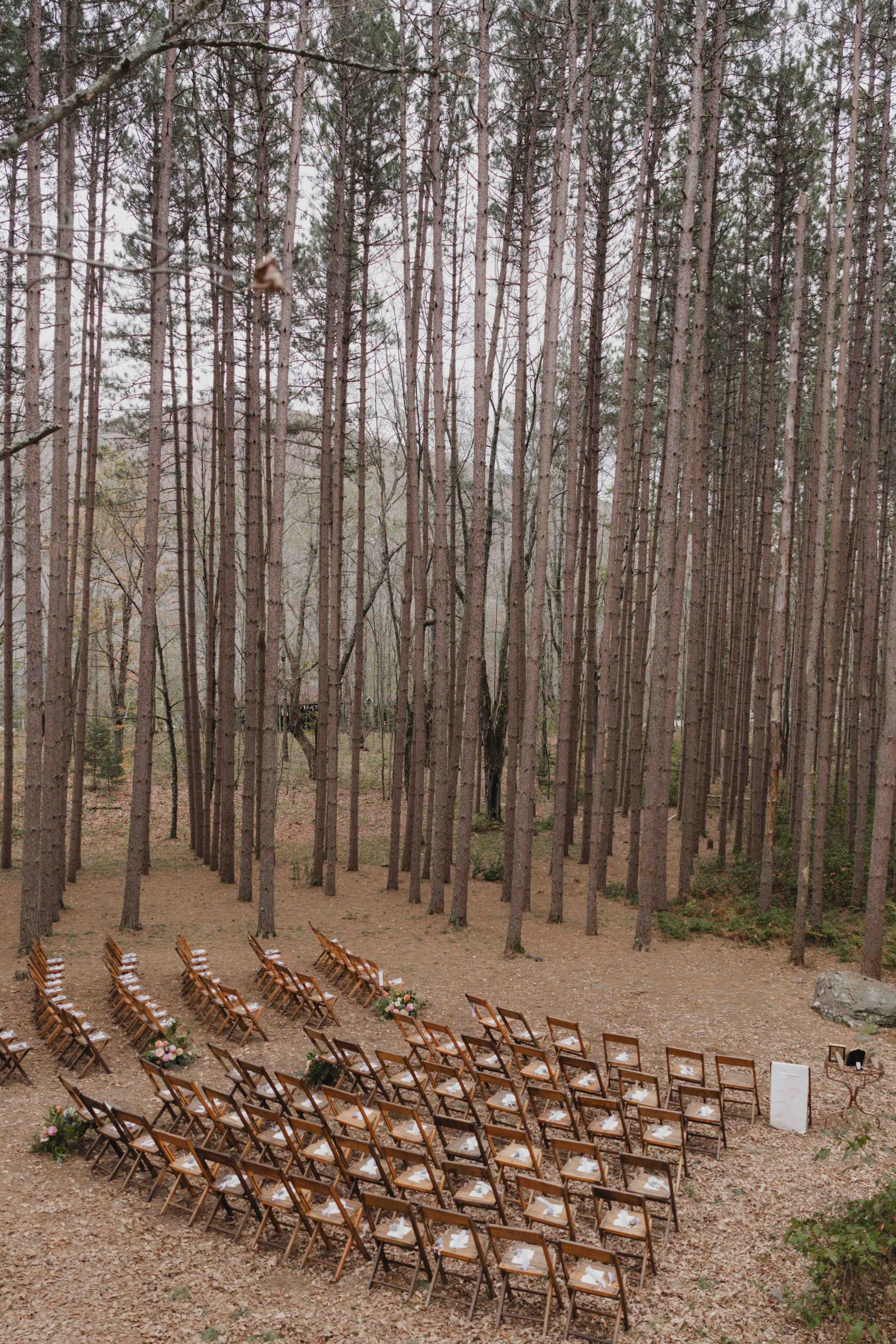 Bride walking on a wooden path in a flowy dress at Roxbury Barn